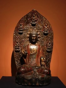 A piece of bluestone painted Buddha statue from the Tang Dynasty