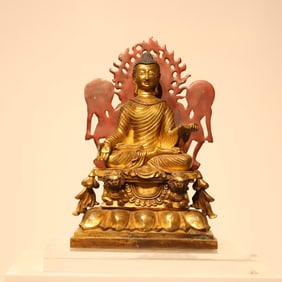 A bronze gilt statue of Shakyamuni Buddha