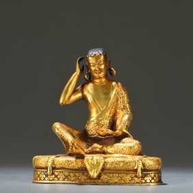 A Tibetan bronze gilt Milarepa ornament