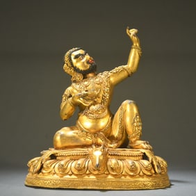 A Qing Dynasty bronze gilt statue of the Great Achiever