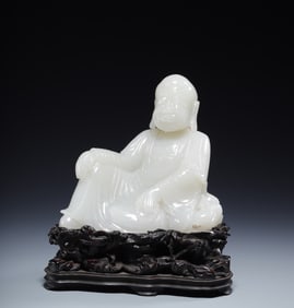 A seated statue of a Hetian jade arhat