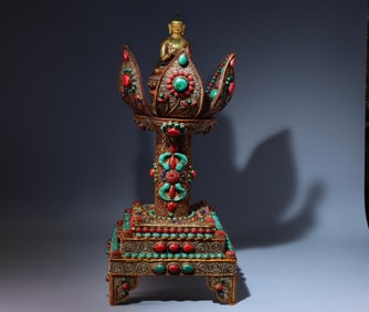 A Tibetan silver filigree inlaid jeweled Buddha shrine