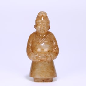 A carved piece of Hetian jade figurines