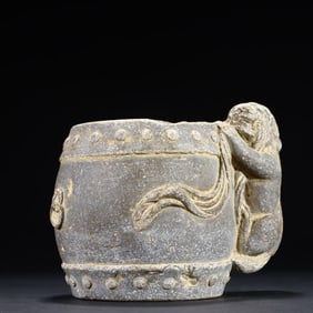 A small stone lion on the desk