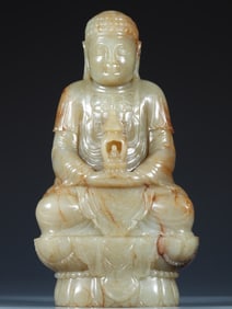 A seated statue of Shakyamuni Buddha made of Hetian jade seeds