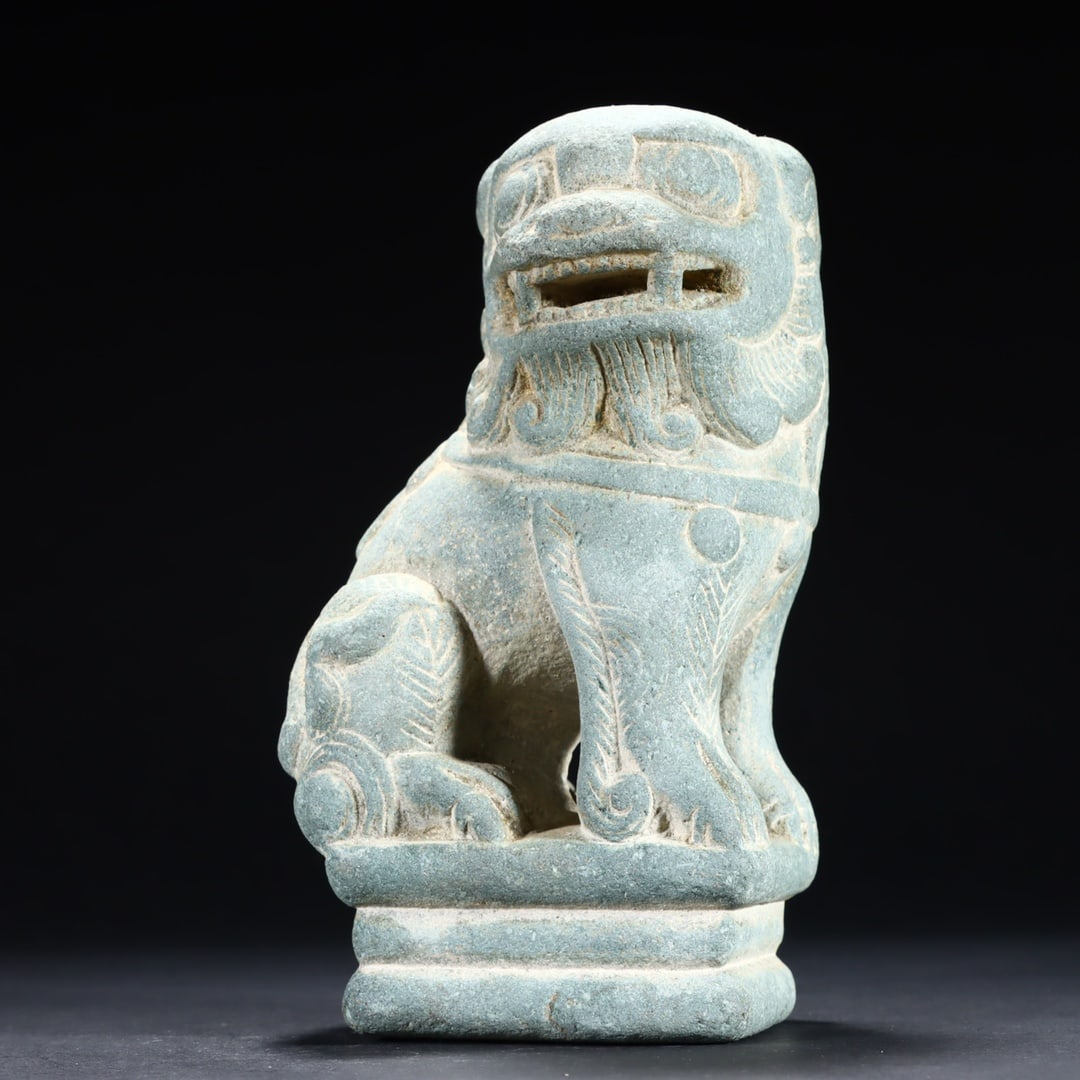 A small stone lion on the desk (1 of 9)