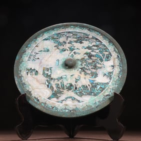 A Tang inlaid turquoise character story bronze mirror