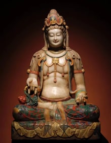 A Tang Dynasty white marble painted Guanyin seated statue