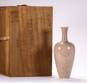 A piece of a red glazed Guanyin vase