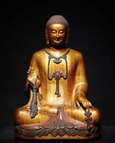 A Northern Qi bluestone gilded painted Buddha statue