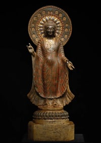 A large bluestone painted Buddha statue from the Tang Dynasty