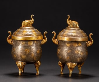 A pair of gilt silver incense burners