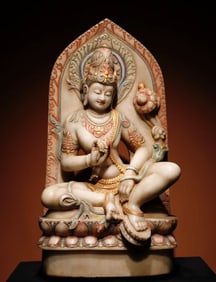 A Ming Dynasty white marble painted statue of Guanyin