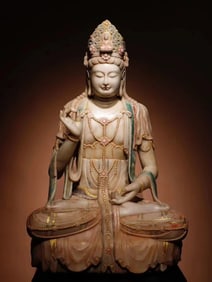 A Tang Dynasty white marble painted Guanyin seated statue