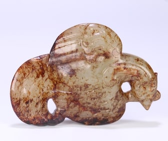 A carving of an ancient jade phoenix bird