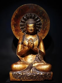 A Tang Dynasty bluestone gilt painted Buddha statue