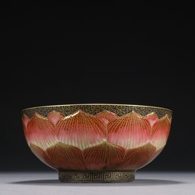 A Qianlong bowl painted in pastel with golden lotus