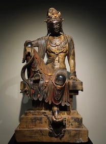 A Tang Dynasty bluestone painted Guanyin seated statue