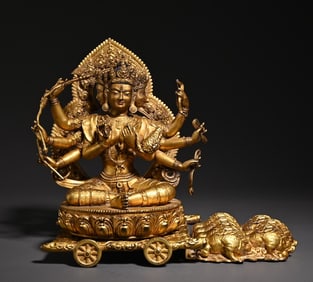 A bronze gilt thousand-handed Guanyin study ornament