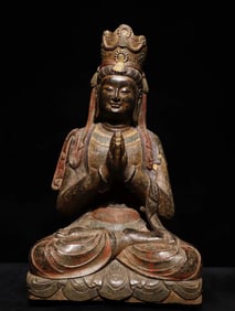 A Tang Dynasty bluestone painted Guanyin seated statue