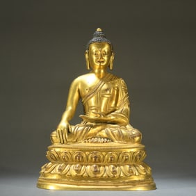 A Qing Dynasty bronze gilt statue of Shakyamuni Buddha