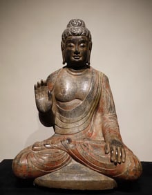 A piece of bluestone painted Buddha statue from the Tang Dynasty