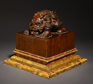 A piece of sandalwood carved beast button imperial seal