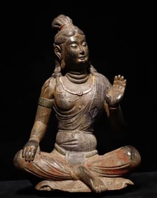 A Tang Dynasty bluestone painted Guanyin seated statue