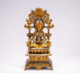 A gilt silver Buddha statue