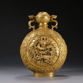 A clear copper gilt chisel flying dragon pattern double dragon ear bottle