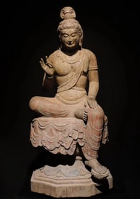 A Tang Dynasty bluestone painted Guanyin seated statue