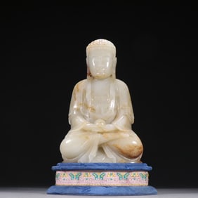 A Qing Hetian jade seed material such as a seated statue of the Buddha