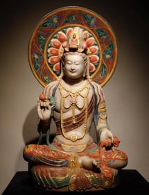 A Tang Dynasty white marble painted Guanyin seated statue