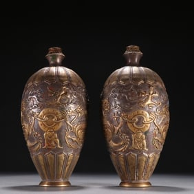 A pair of Tang silver gilt chisel dragon and tiger pattern reward bottles