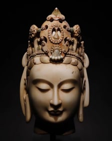 A Northern Qi white marble painted Guanyin head ornament