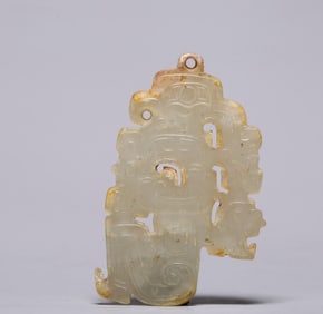 A piece of Shang and Zhou Dynasty Hetian jade dragon figurines were admired