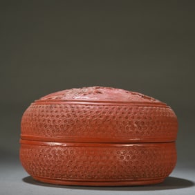 A Qing Dynasty red lacquer carved book picture cover box