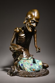 A cloisonné enamel skinny Arhat scholar's ornament