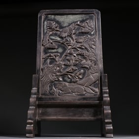 A stone carving of a unicorn pine tree poem interstitial