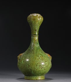 A piece of a twisted lion face auxiliary ear garlic bottle