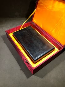 A piece of inkstone with the original wooden box