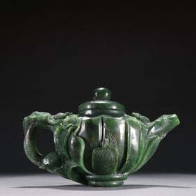A piece of jasper carved "more than every year" lotus-shaped teapot