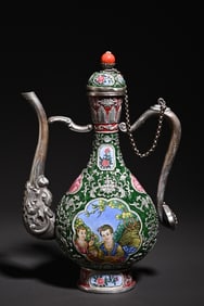 An enamel silver tire Western figure holding a pot ornament