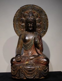 A piece of bluestone painted Buddha statue from the Tang Dynasty