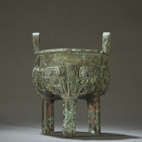 A gluttonous bronze round tripod