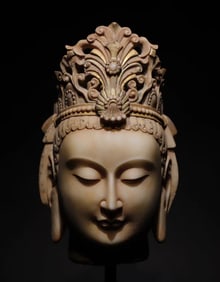 A Northern Qi white marble painted Guanyin head ornament