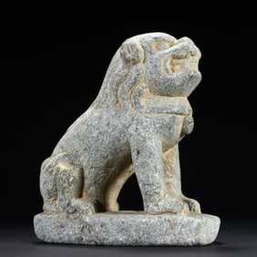 A small stone lion on the desk