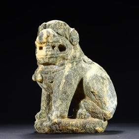 A small stone lion on the desk