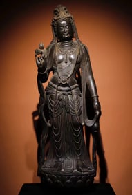 A Tang Dynasty bluestone carved painted Guanyin standing statue
