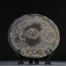 A Han bronze dragon and phoenix pattern bronze mirror